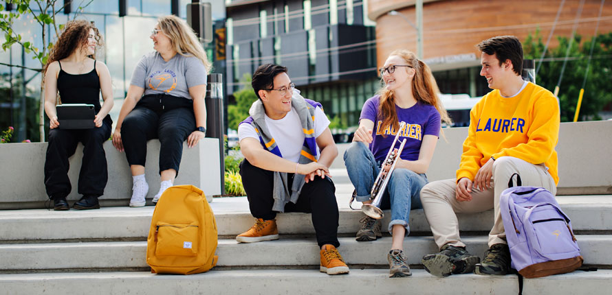 students sitting outside