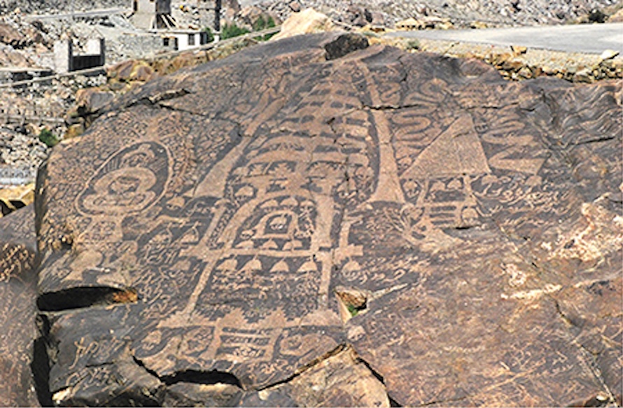 Large flat rock with intricate art design