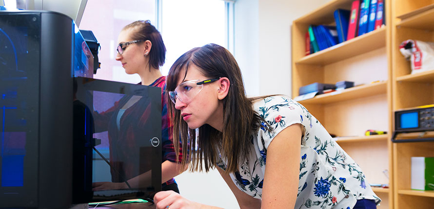 Student working at 3D printer