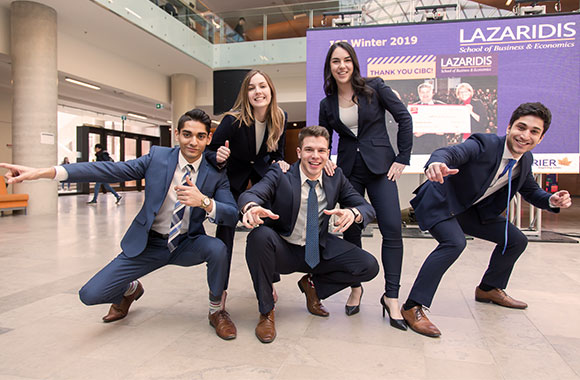 Five students posing. 