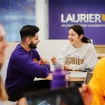 student sit at table