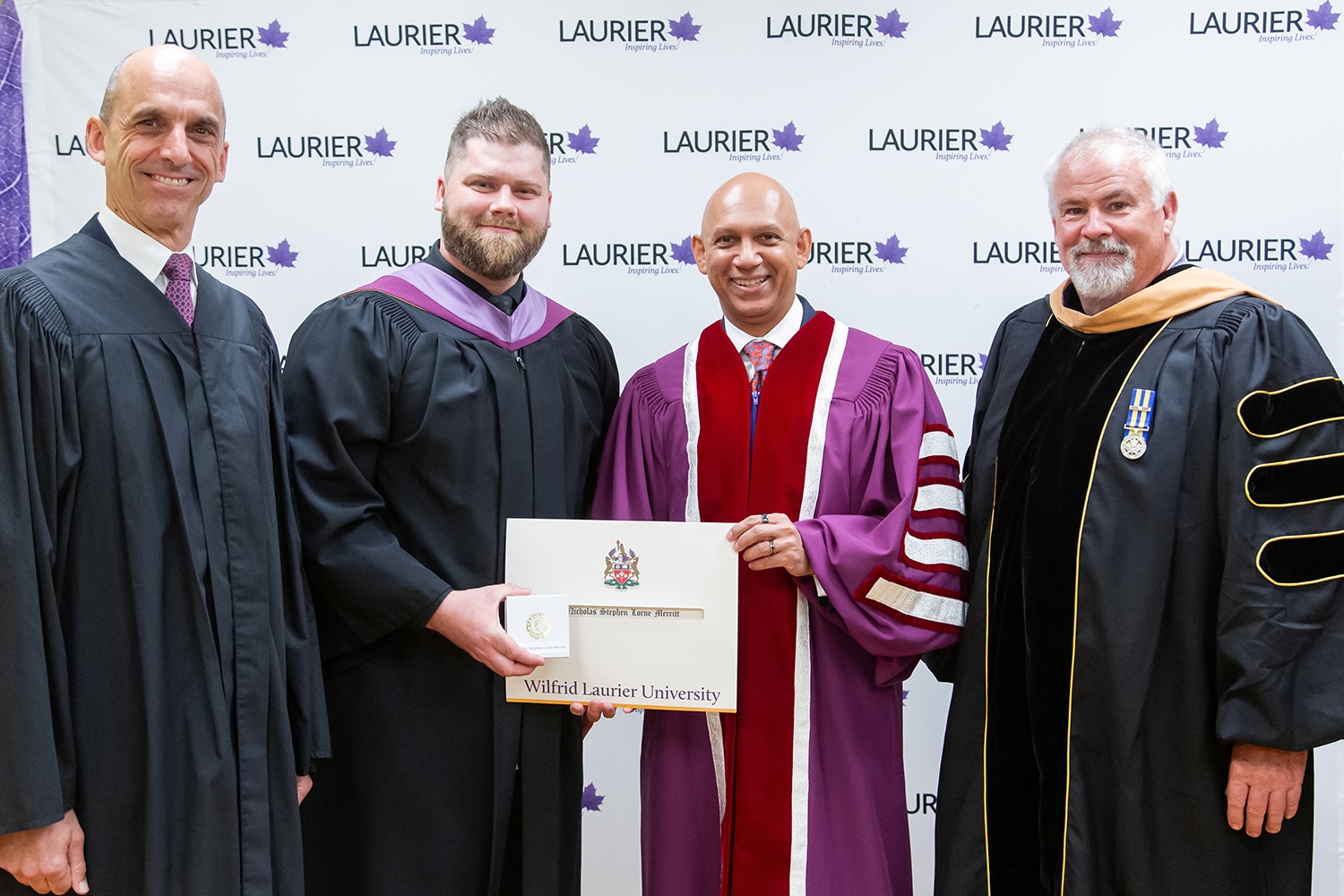 Nick Merritt with Laurier chancellor and faculty