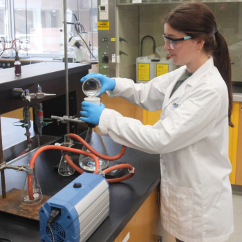 Lab technician Sam Zulian (MSc ‘23) demonstrates the new vacuum pump that replaced the water aspirator