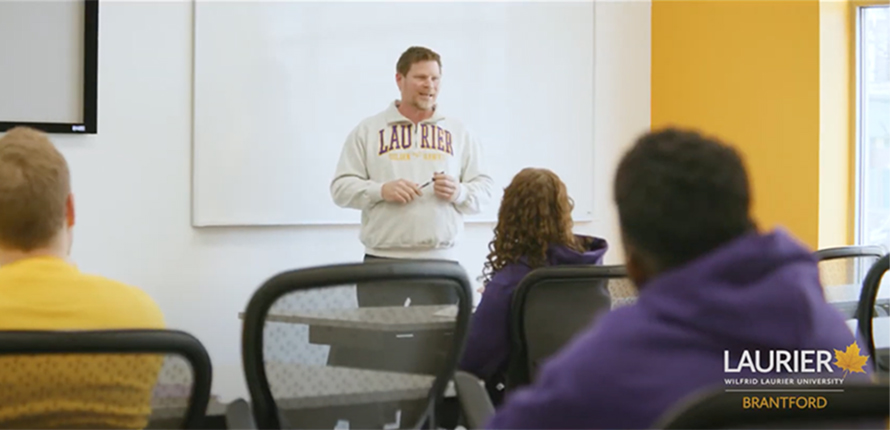 Professor lecturing to students in classroom